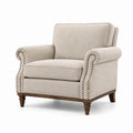 Poltrona in tessuto beige con struttura in legno massello